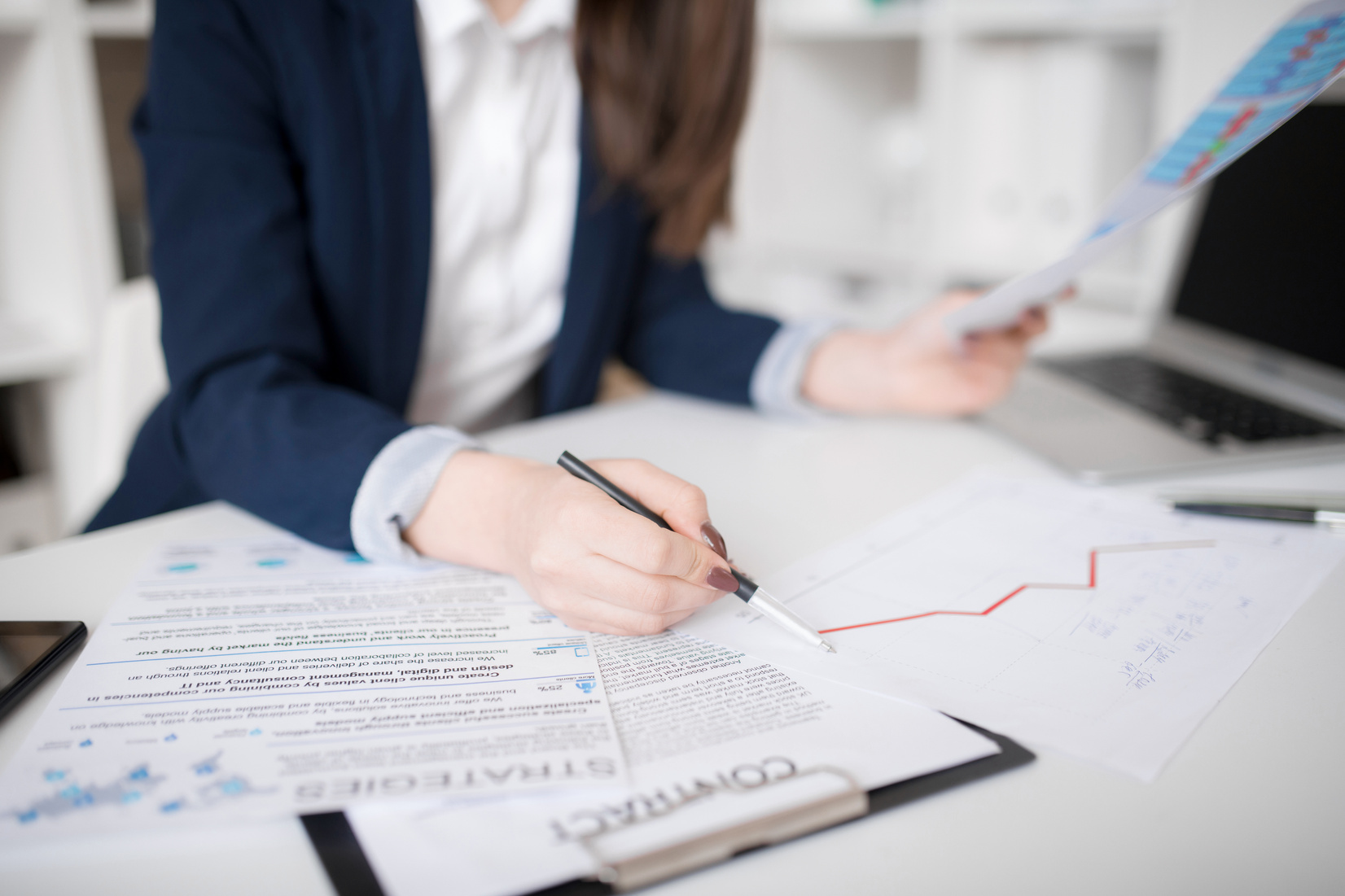 Business specialist preparing documents before meeting